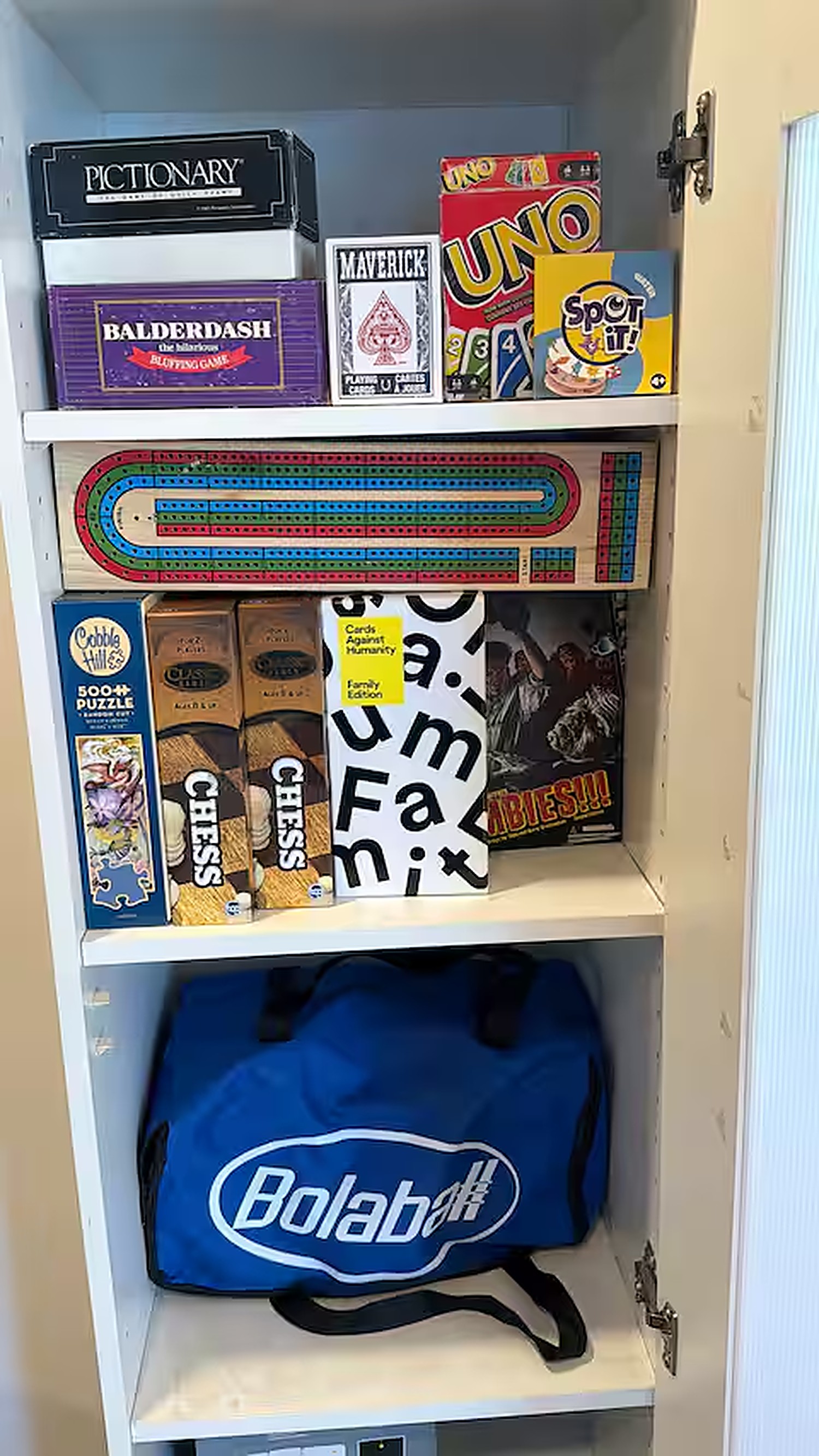 Cabinet stocked with board games