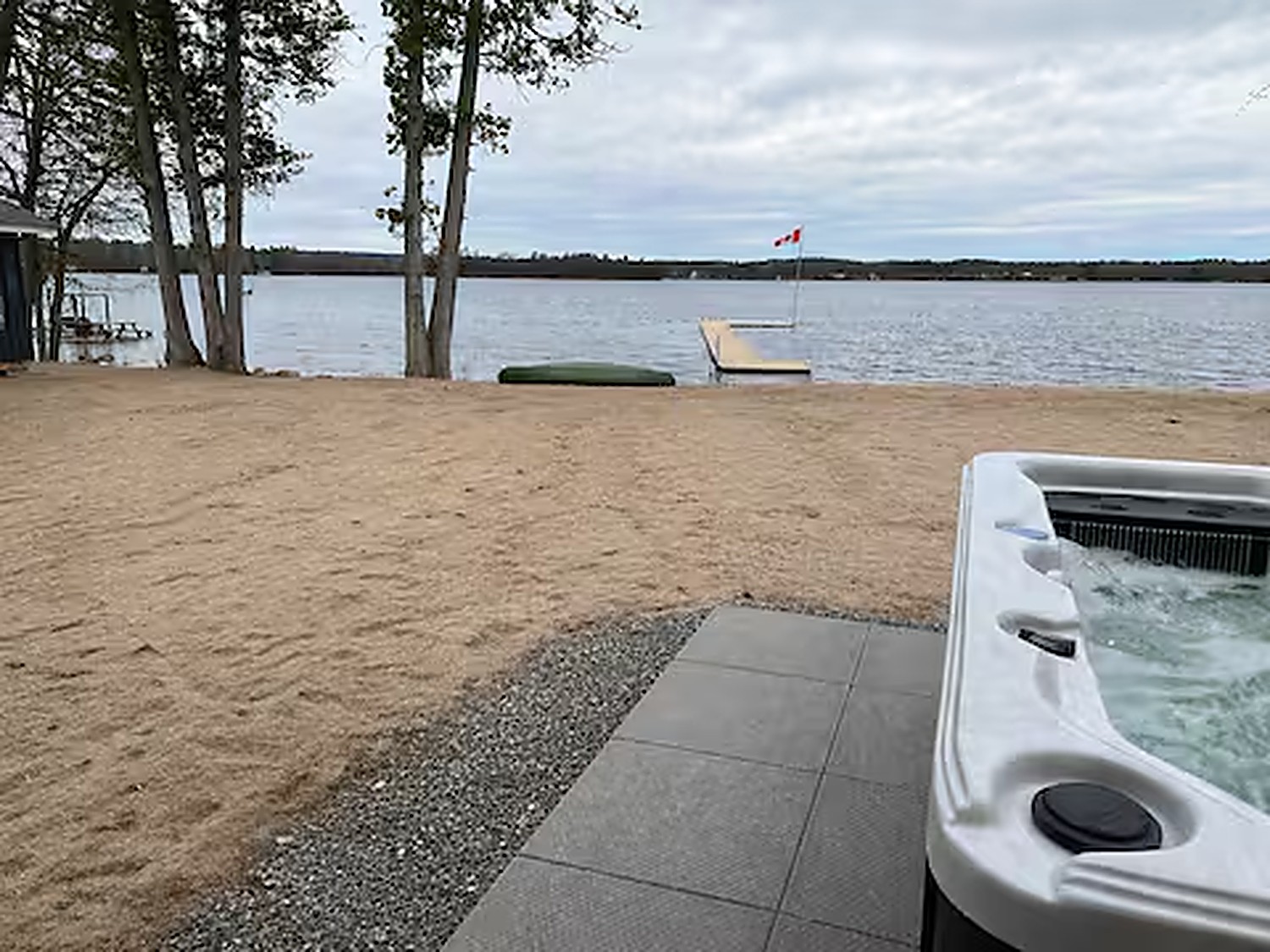 Hot tub with lake and dock views